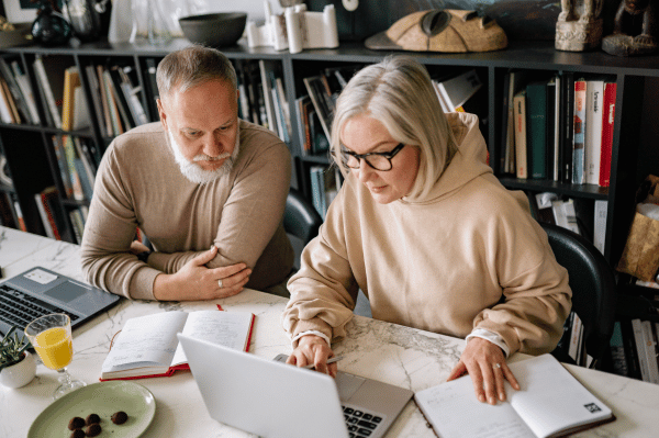 couple reviewing on computer