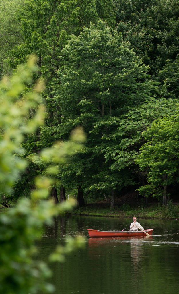 Resident canoes on pond