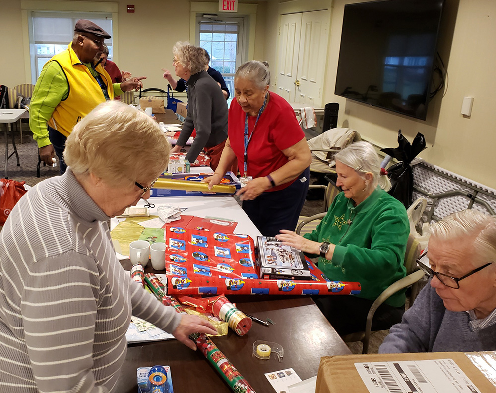 Senior Living residents wrap presents