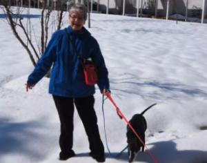 Independent Living resident walks dogs during Maryland winter