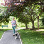 collington-woman-with-dog-walking-trail