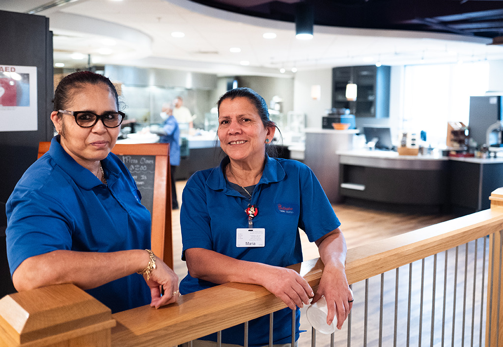 two dining room staff members