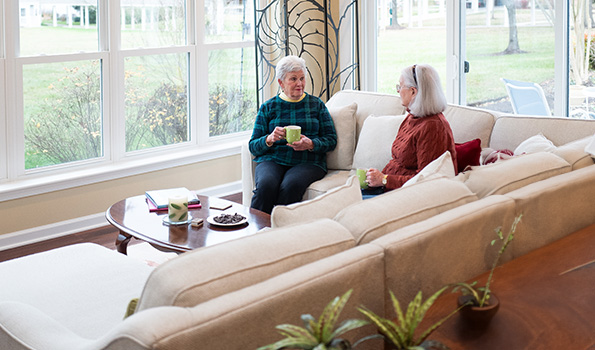 residents chatting in sunroom