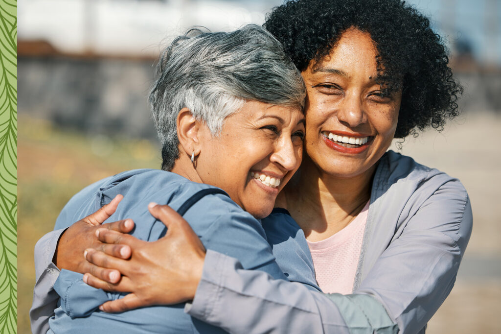 two women hugging and smiling