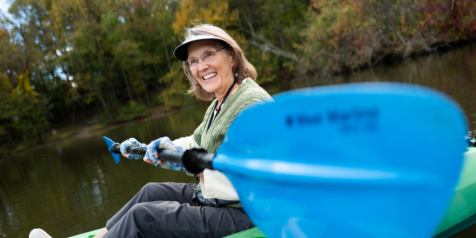 woman kayaking on lake