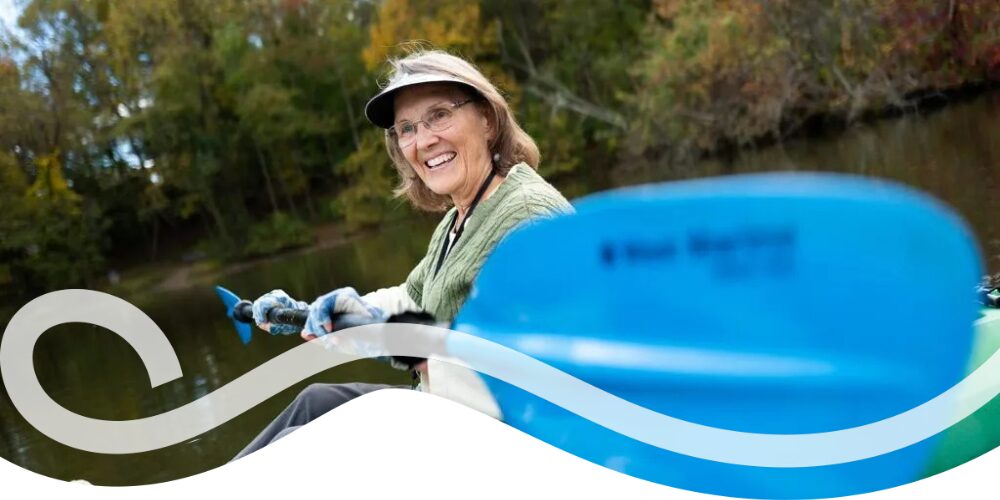 woman kayaking on lake